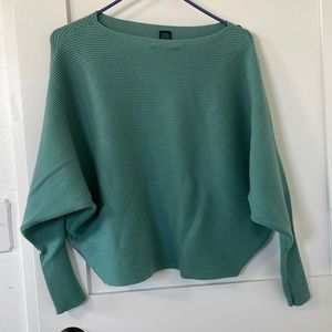 Faith of Zoe teal bat wing shirt with black buttons on left sleeve